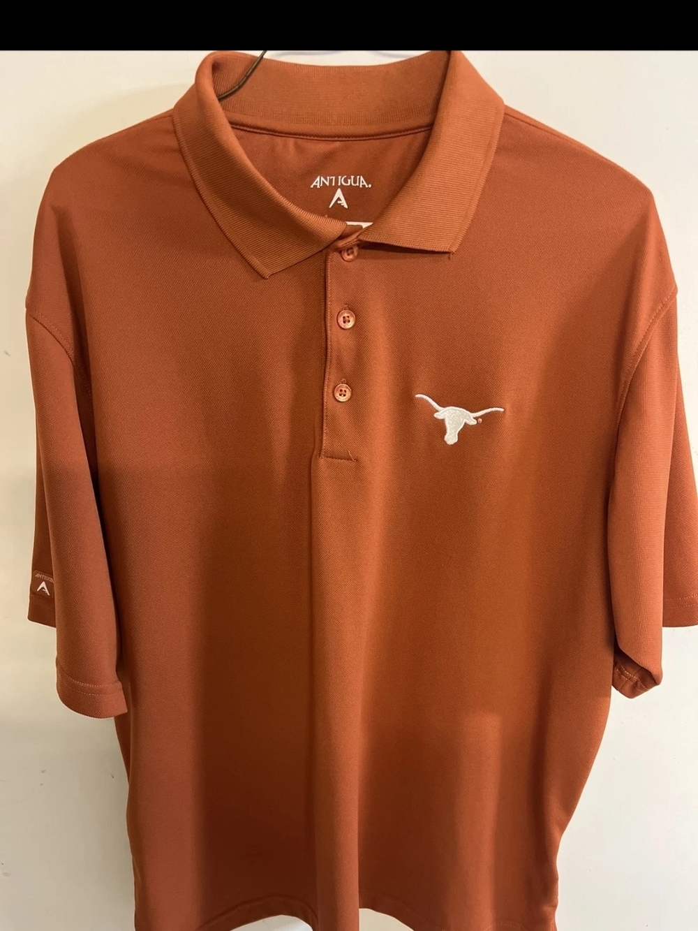 Antigua Men’s Burnt Orange Polo with White Longhorn Logo